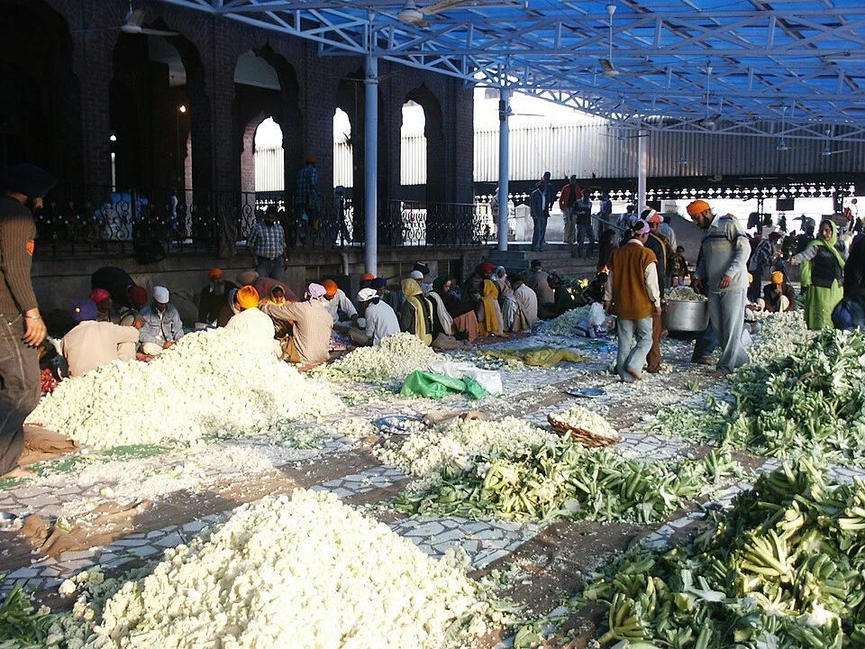Volunteers preparing food at Guru Ram Das Langar inside Golden Temple Volunteers preparing food at Guru Ram Das Langar, Golden Temple