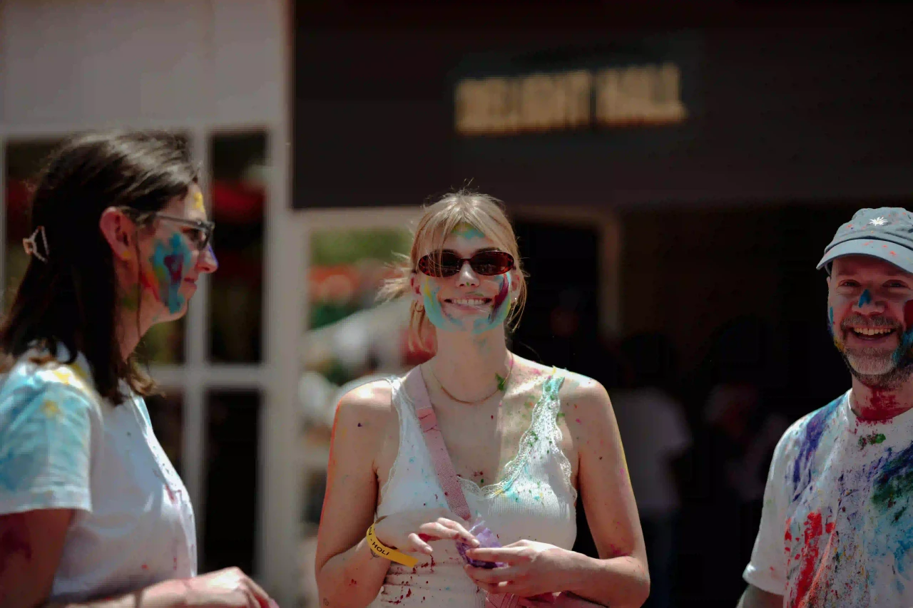 International travellers playing Holi