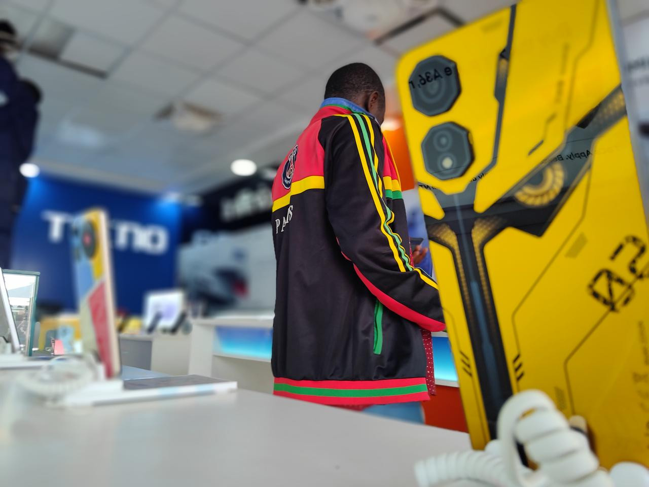 Customer handling cash payment for a disciplined phone purchase