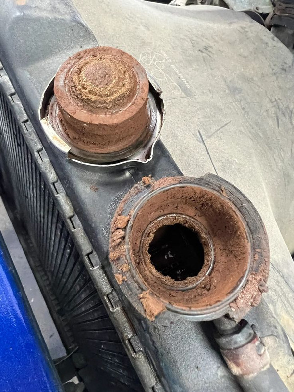 Rusty, corroded radiator neck and cap