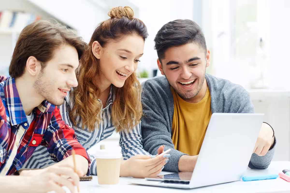 Group of students happy about filing taxes by avoiding top mistakes 