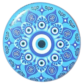 a blue pin of a sort of mandala surrounding an evil eye