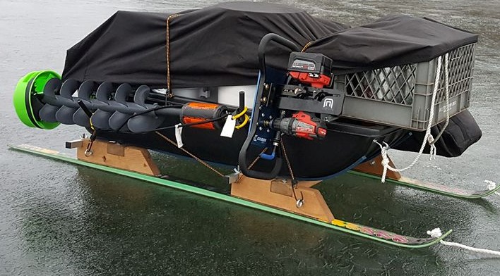 auger holder on sled