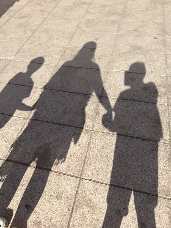 Two silhouettes, shadows cast long