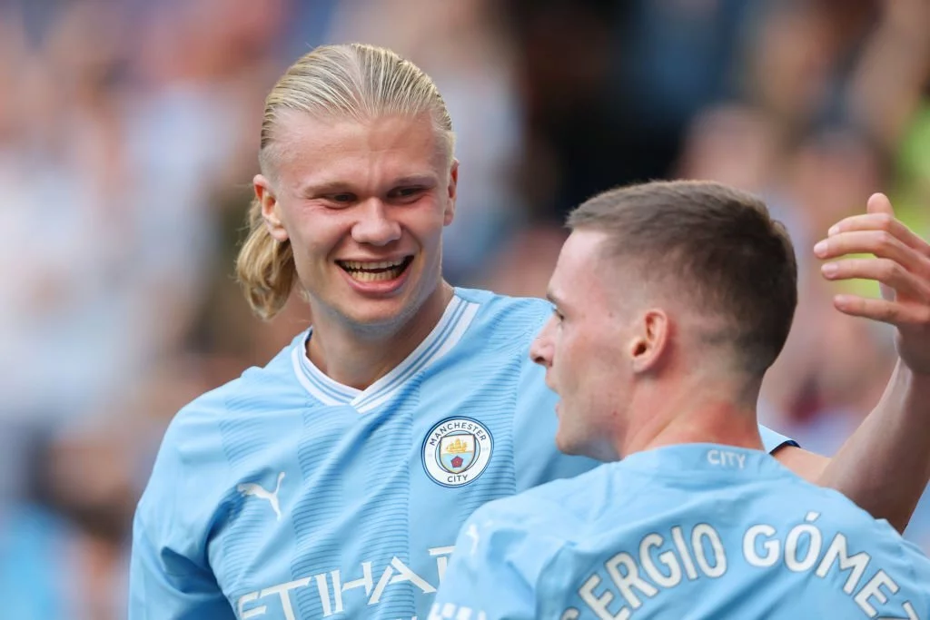Erling Haaland of Manchester City celebrates his goal with Sergio Gomez.