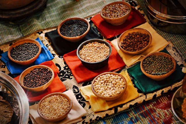 a colorful image with lentils and legumes in different bowls