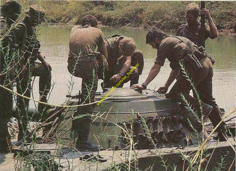 PT-76-sadf05-SADF-Special-Forces-inspect-a-FAPLA-PT-76-amphibiuos-tank-stuck-in-a-river-during-one-of.jpg