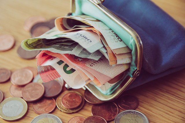 purse-full-of-money-royalty-free-image-1656504415.jpg