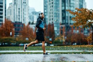 side-view-of-sportsman-running-while-exercising-in-the-park-during-rainy-day-300×200.jpg