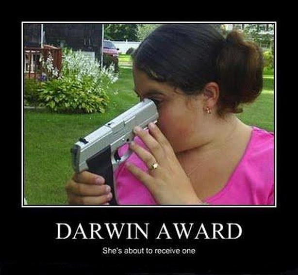 darwin_award_for_looking_down_barrel_of_handgun.jpg