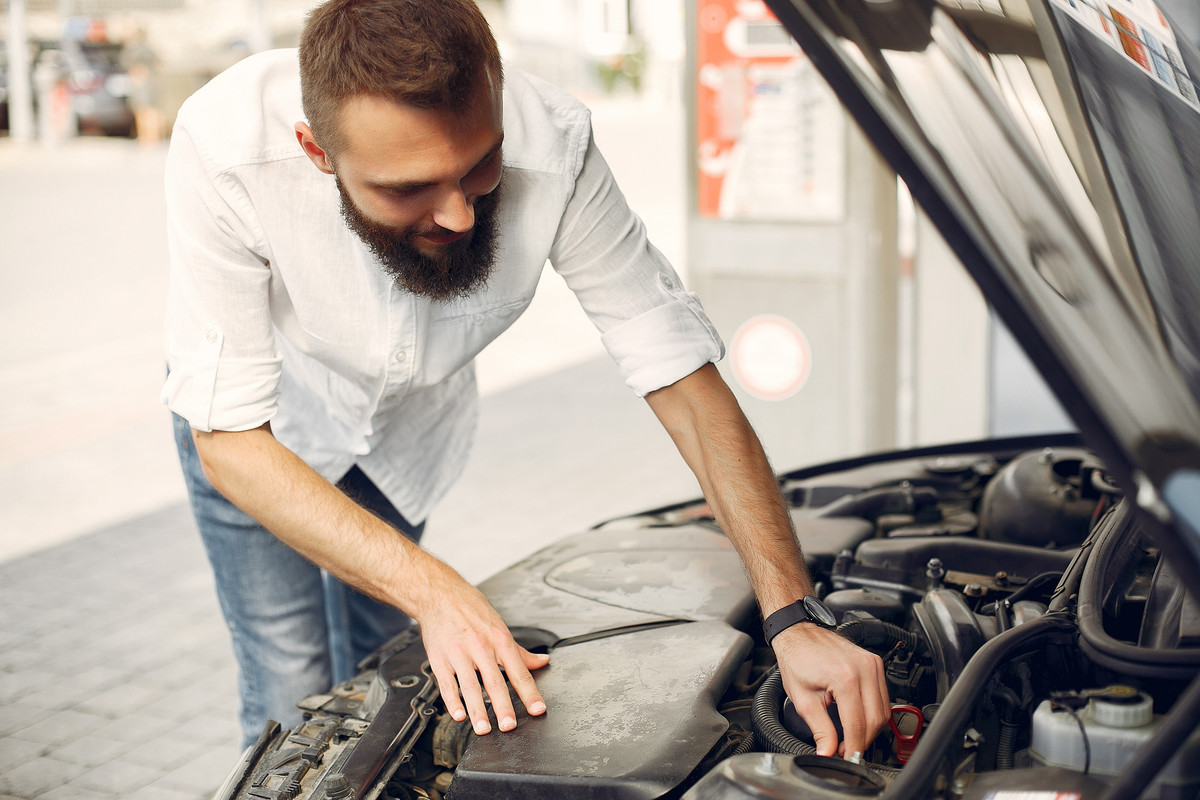 handsome-man-checks-engine-his-car (1)