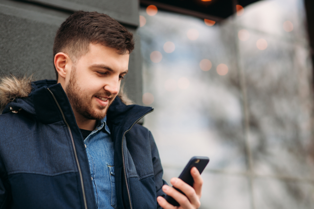 Man-Holding-Phone-Banner-Photo-1-1024x683.png