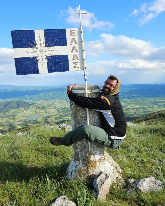 Apostolis hagging the summit pole