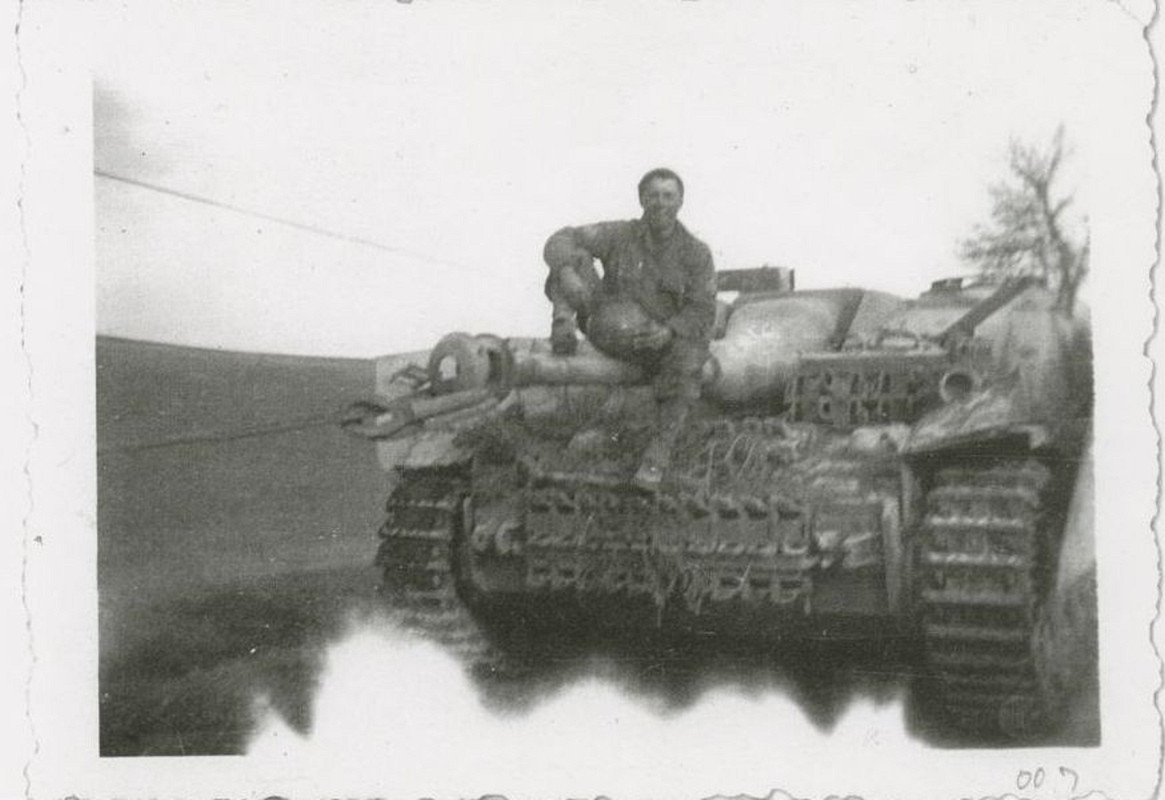 photographs of soldiers around tanks in Germany.  (2)