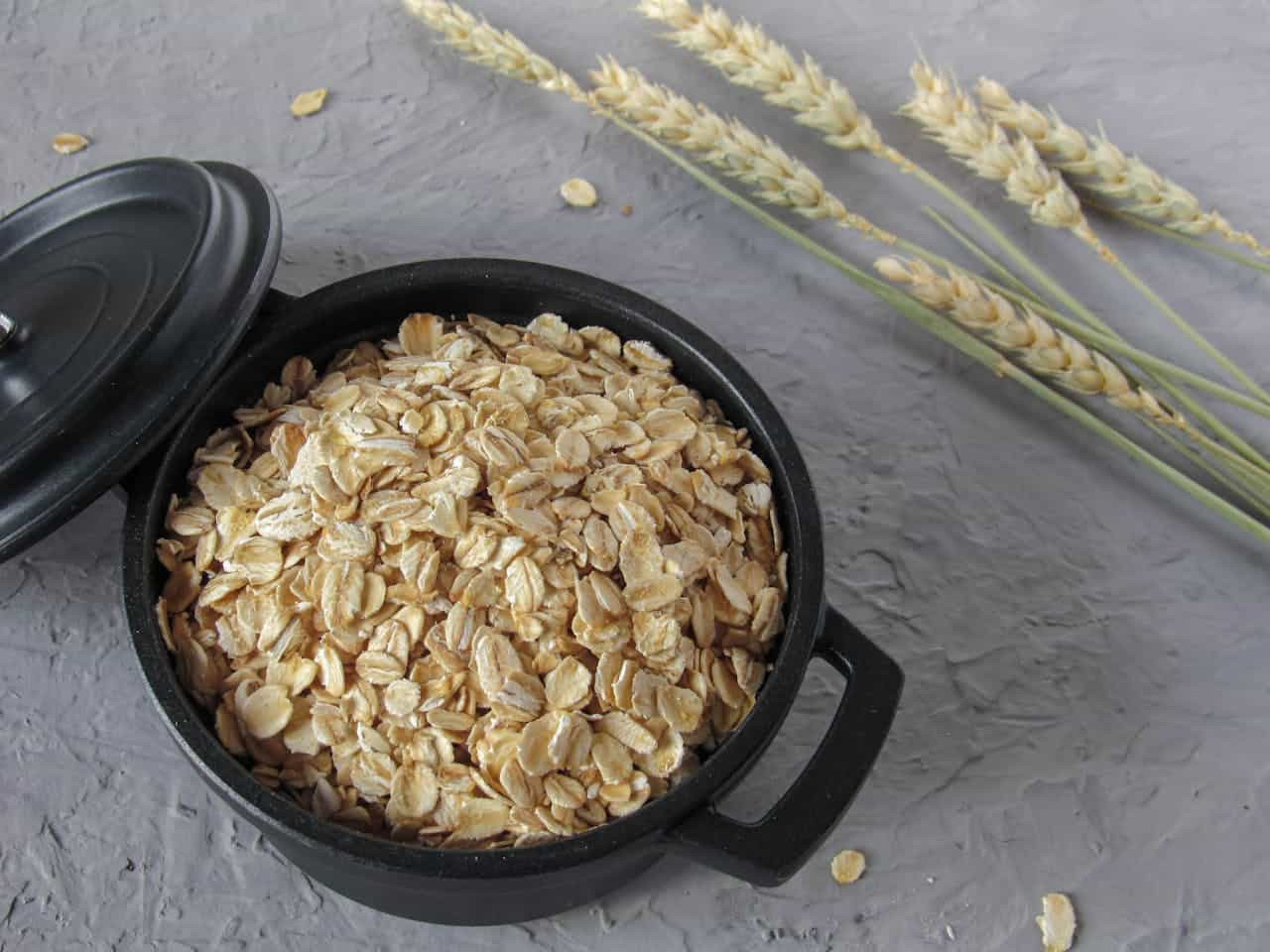 a pot full of oats with the lid on the side