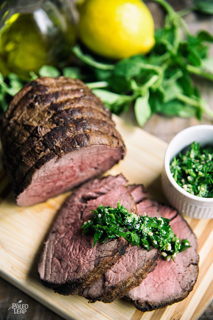 Roasted red meat steak served with lemon, olive oil and herb sauce