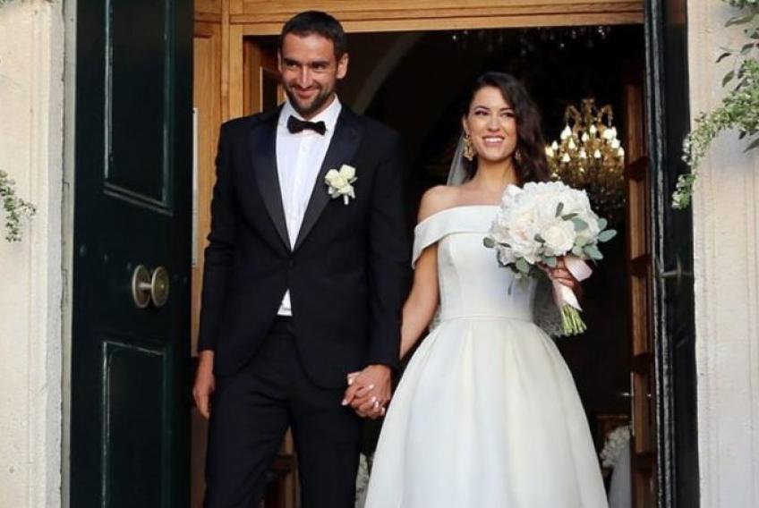 Marin with his wife in their wedding