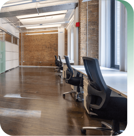 Spec office with multiple tables and chairs