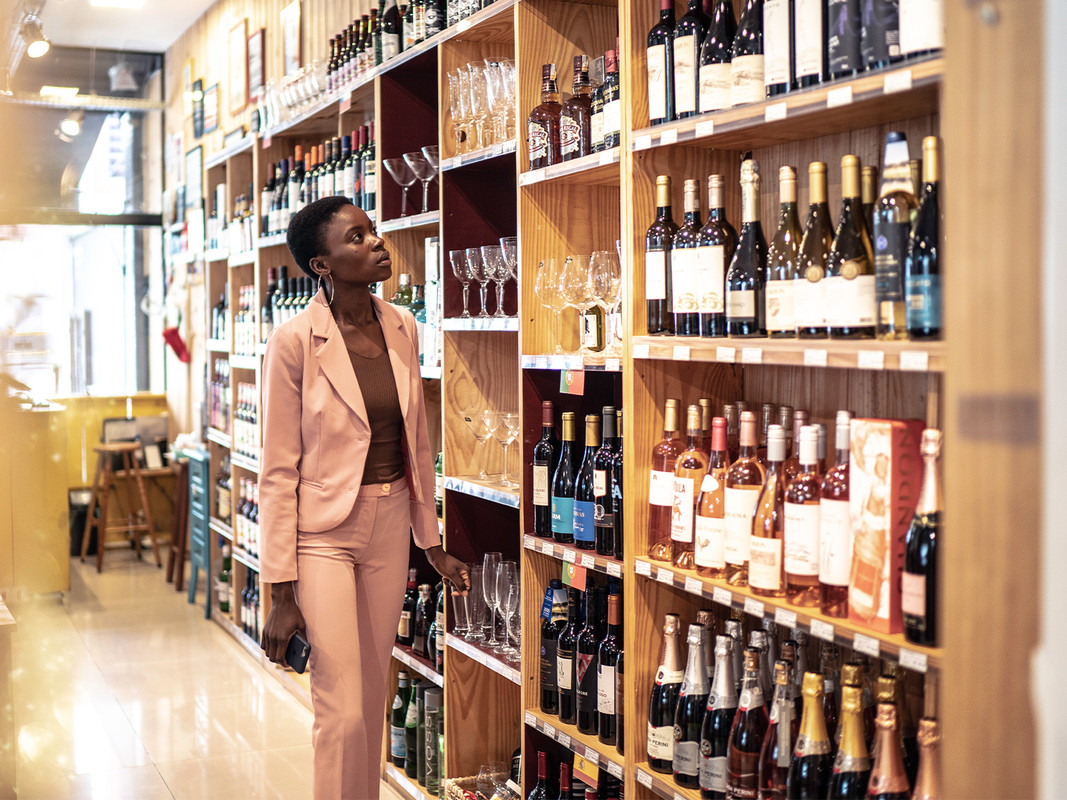 What are the benefits of visiting a fine-wine store?