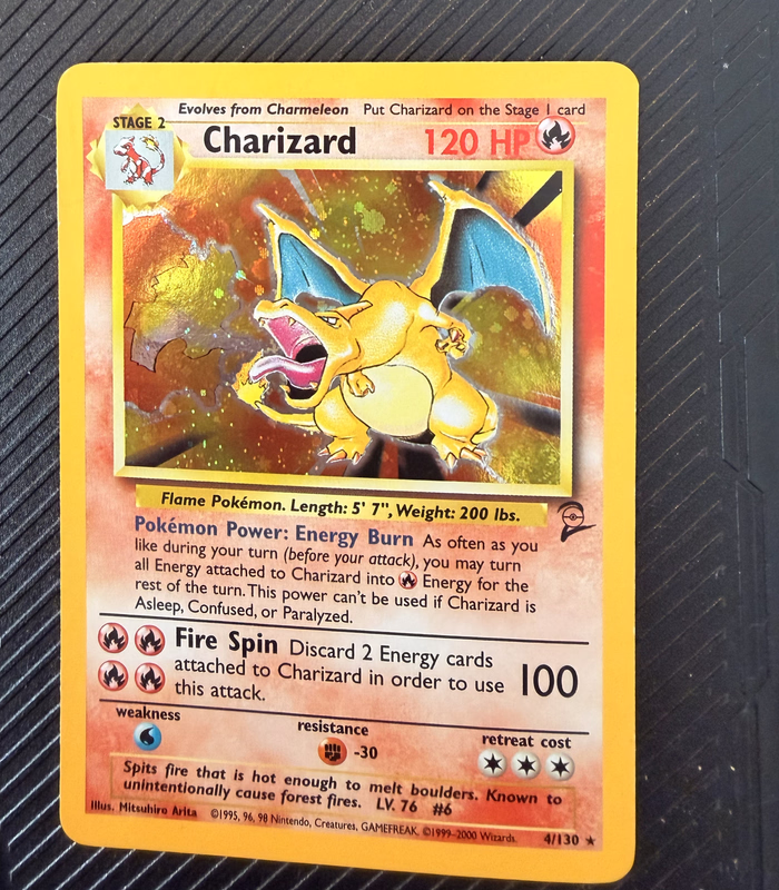 Base Set Charizard Pokémon card after surface cleaning and polishing