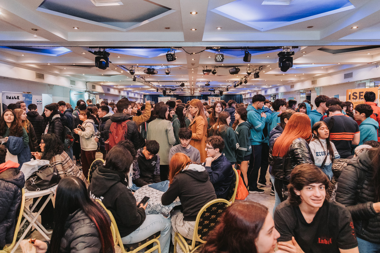 People networking in a conference hall.
