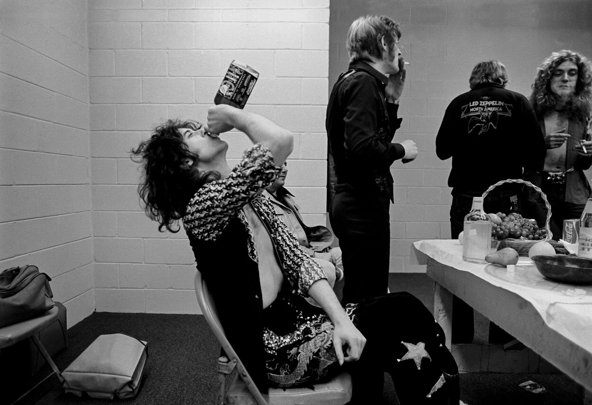 Jimmy-Page-guzzles-whiskey-backstage-in-