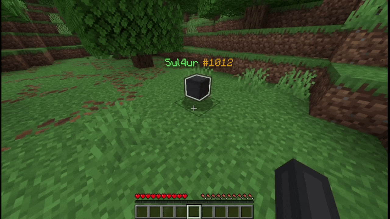 The player sneaks near the grave. After doing so, the player head and the text display change to show an item stored in the grave, cycling through them one by one. The player right-clicks and receives one of the items of the grave.