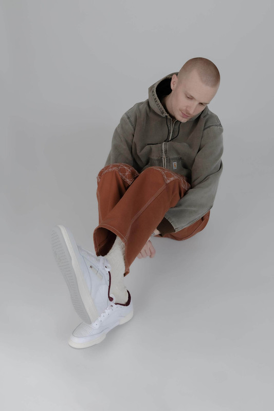 Man in Reebok sneakers