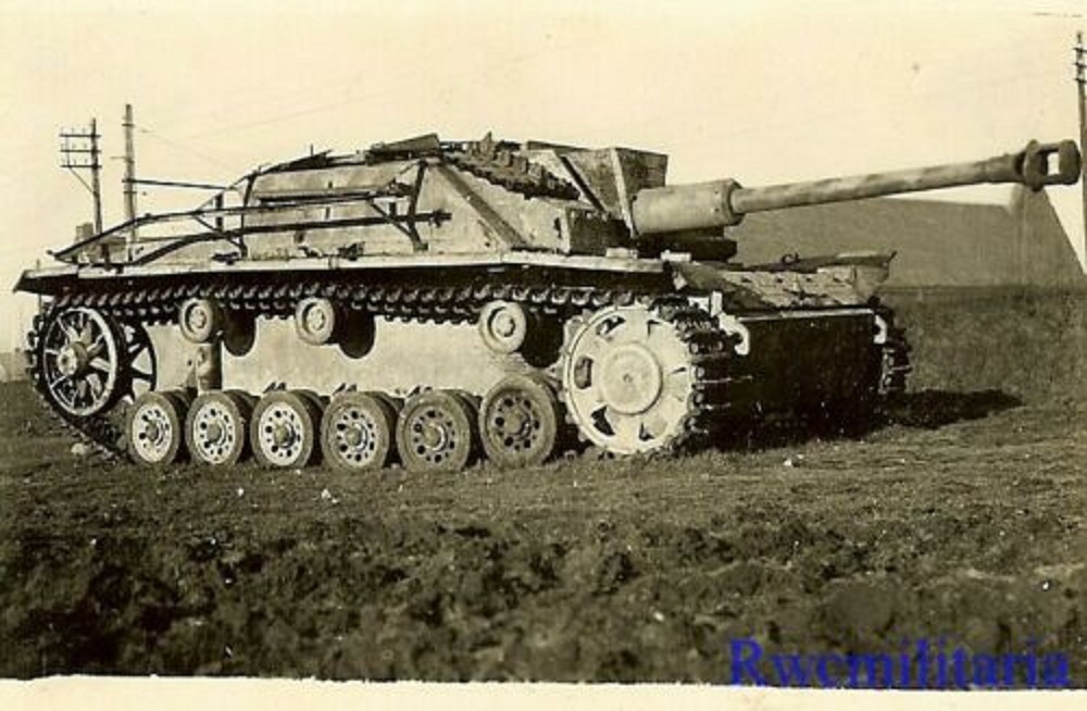 US Soldier View KO'd German Sturmgeschütz Panzer Tank in Field