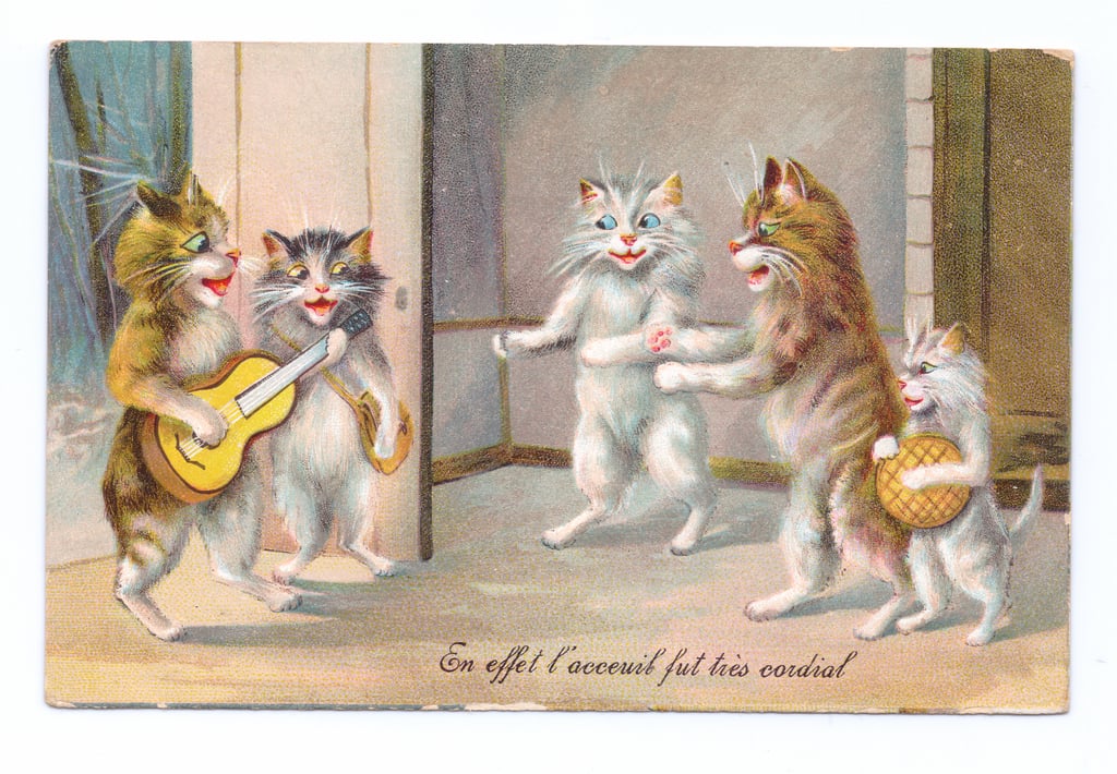 13-Louis-Wain-Edwardian-postcard-of-a-cat-playing-a-guitar-with-three-other-cats-and-a-kitten-M