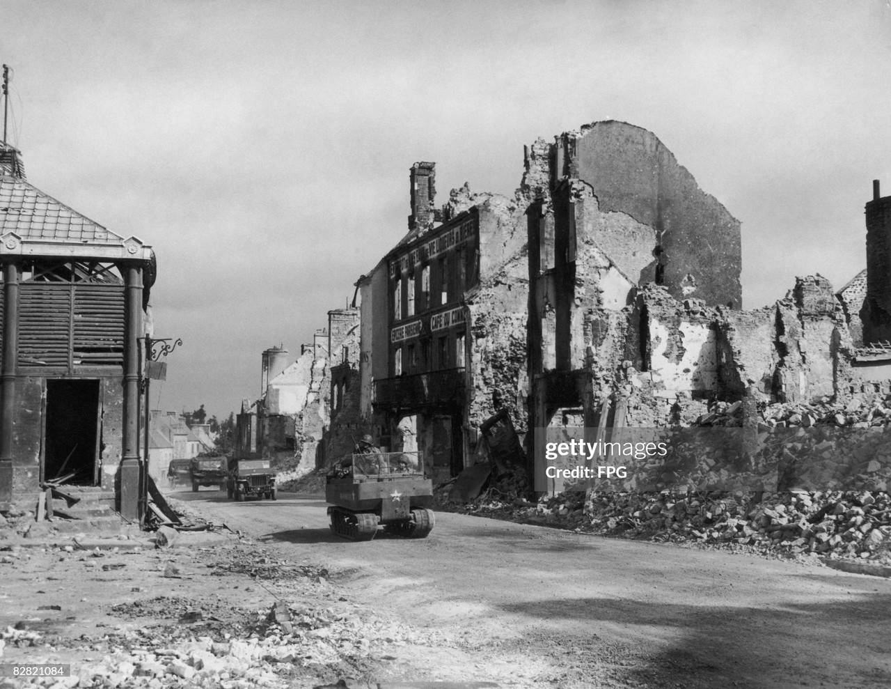 11 US armoured units move through the devastated French town of Valognes in Normandy during World Wa