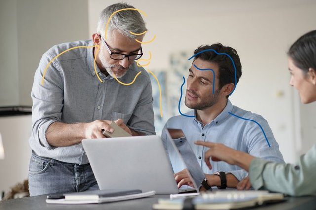 two-man-conversation-behind-laptop-yellow-blue-LR-790x527.jpg