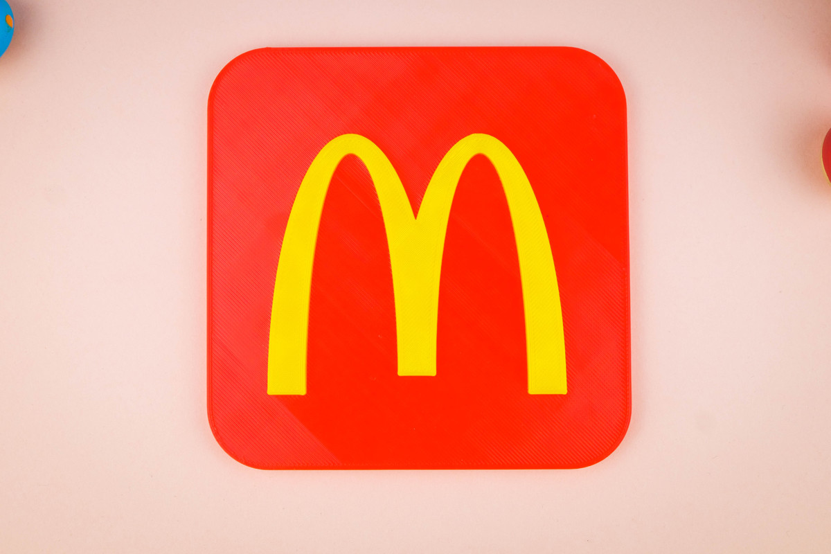 20th Century Fox Logo in yellow colors in a light blue and soft pink background. There are wooden toys for a decorative.
