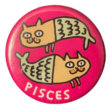 a silly pink pin that says 'PISCES' in white on it and has two cats with fish tails, immitating the pisces symbol