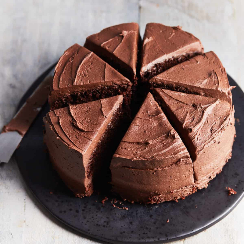 Mini dark cocoa cake with brown butter frosting using an air fryer.