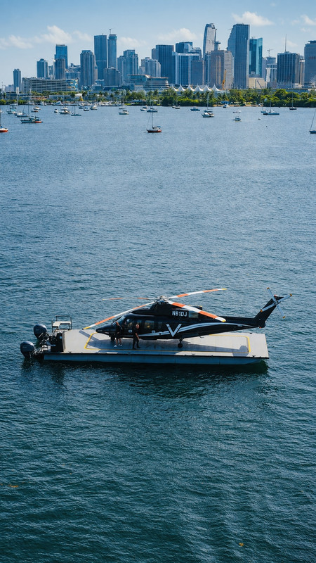 Helicopter landing on water platform serving Miami and Biscayne Bay