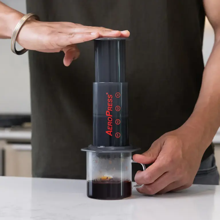 AeroPress coffee maker brewing fresh coffee