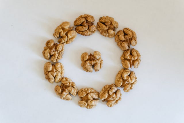 Peeled walnuts placed on a table forming a circle