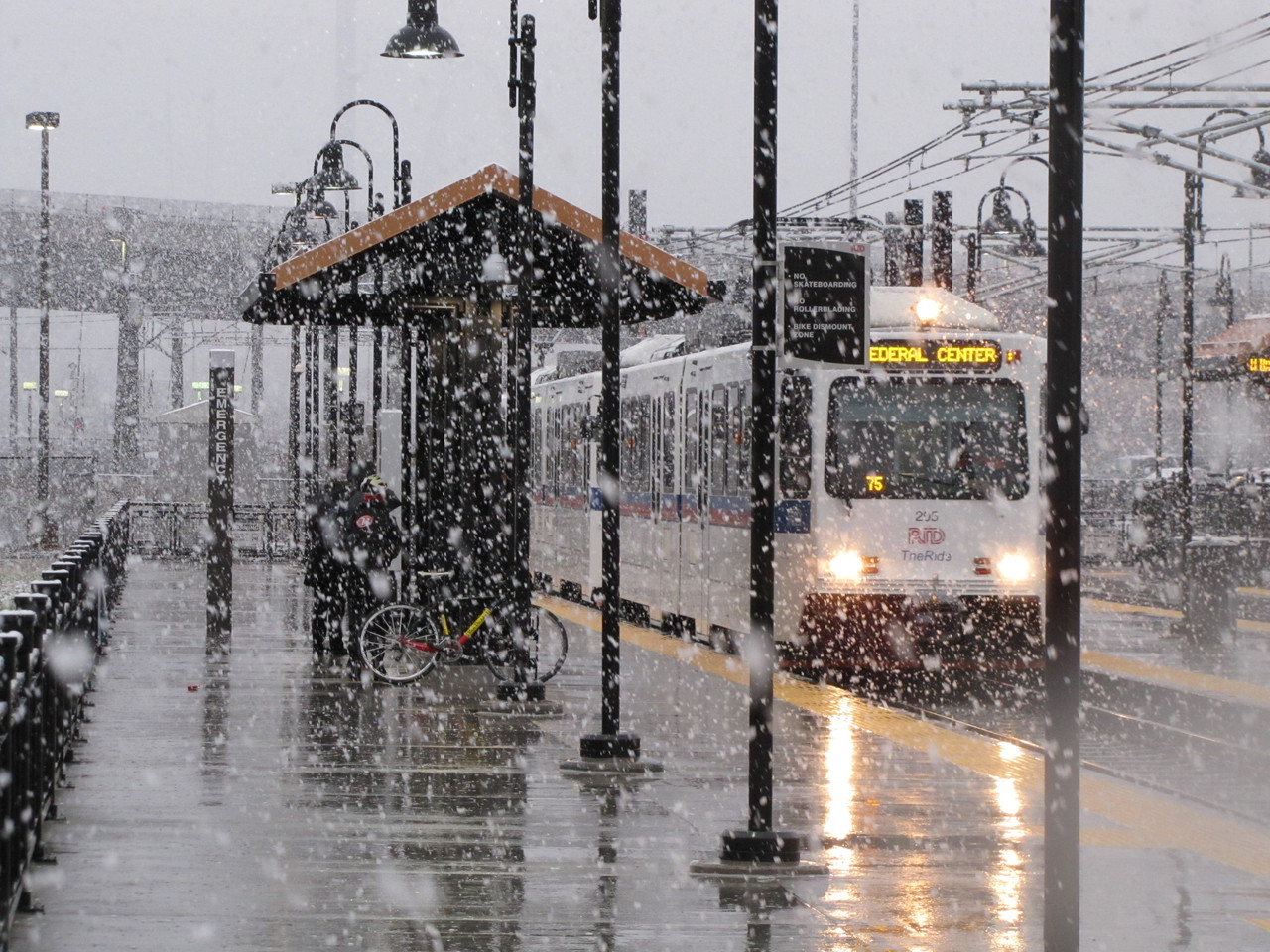 Denver light rail in the snow by Eric Miller