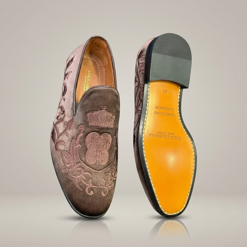 Tan leather penny loafers with gold hardware detail