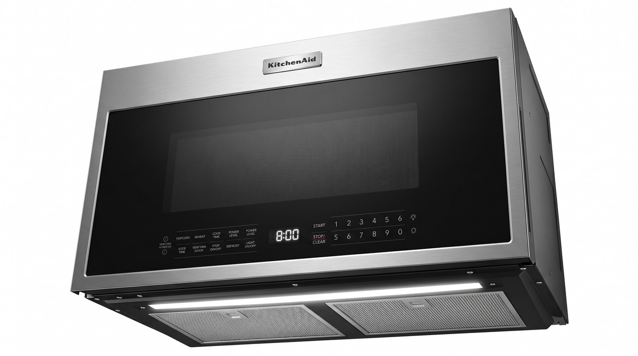 Microondas extractor Frigidaire de acero inoxidable instalado sobre estufa