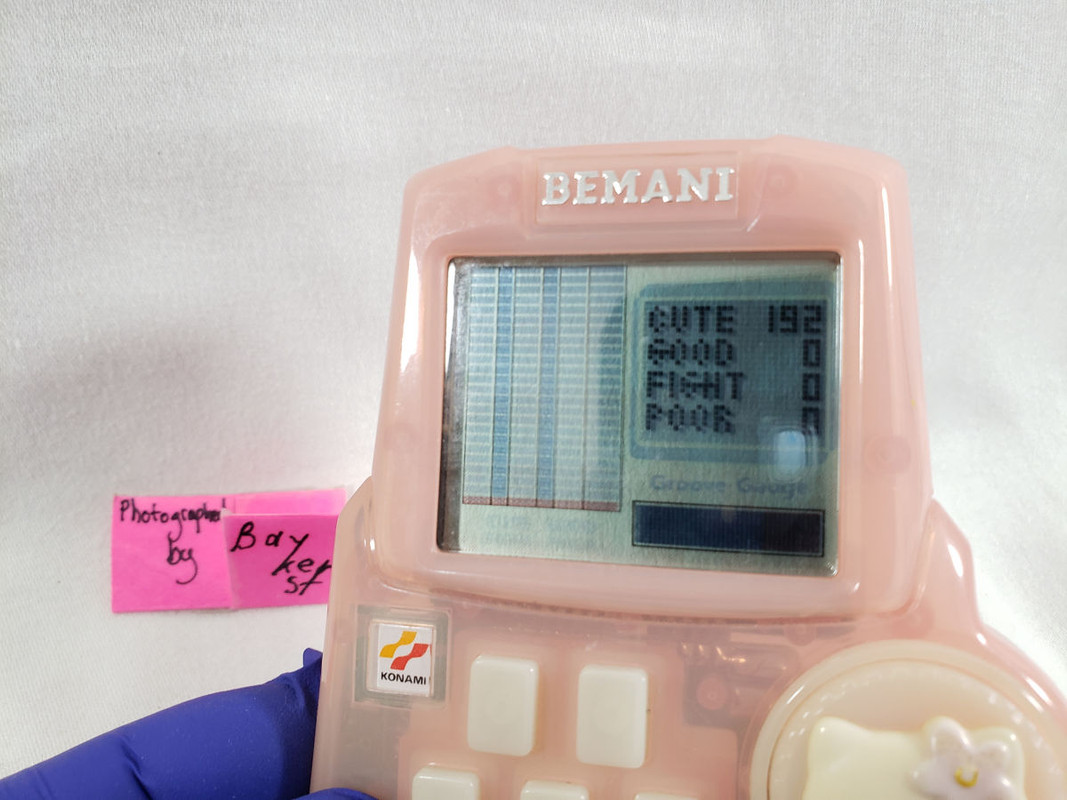 Hello Kitty Bemani Beat Mania Handheld keychain LCD Game face