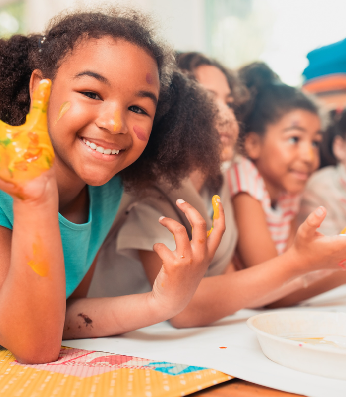 School-age children painting after school