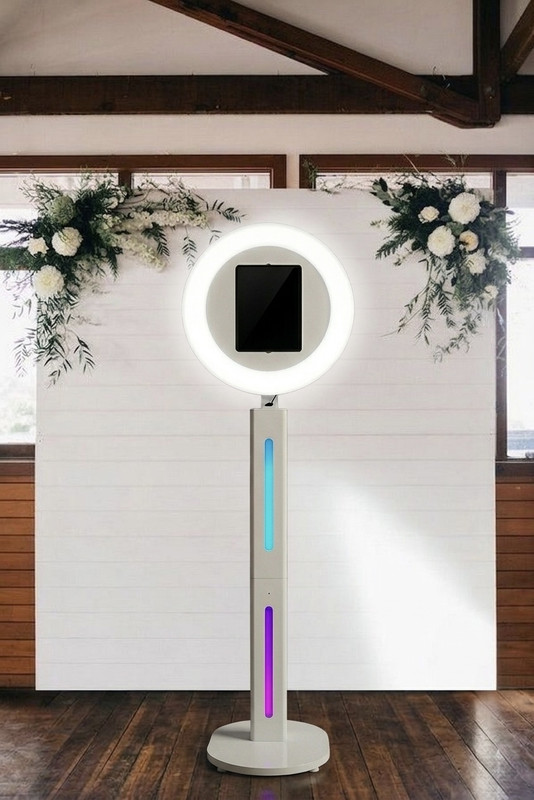VibeCam booth in front of a floral backdrop
