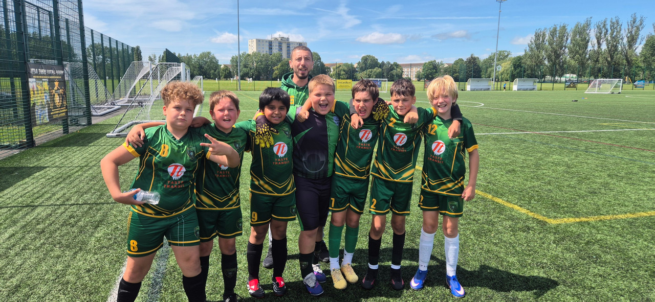 Constantine Football Club team huddle before a match in Colindale
