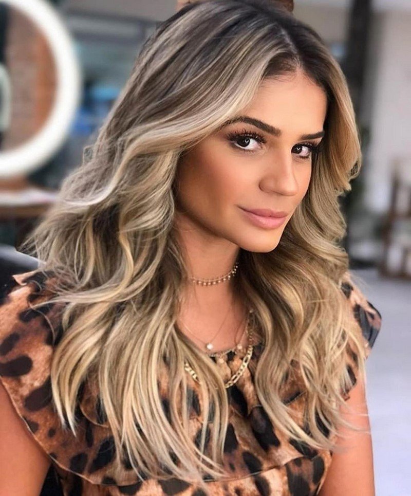 Long hair in blonde beige curls