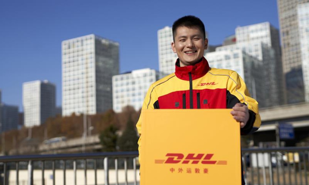 DHL delivery driver in China providing premium express shipping services - reliable international courier