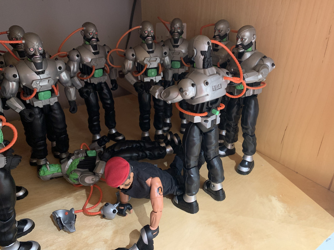 Action Man vs 14 silver robots. D1390-DB4-B672-436-E-865-C-98-A4-D3-EAAB53