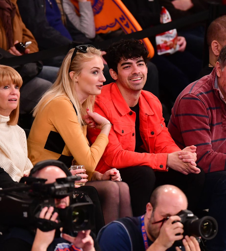 Sophie-Turner-Crossed-Legs-in-Pantyhose-Attend-sacramento-king