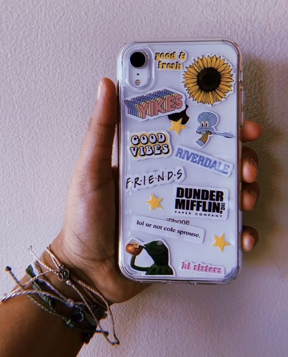 a clear phone case with trendy stickers